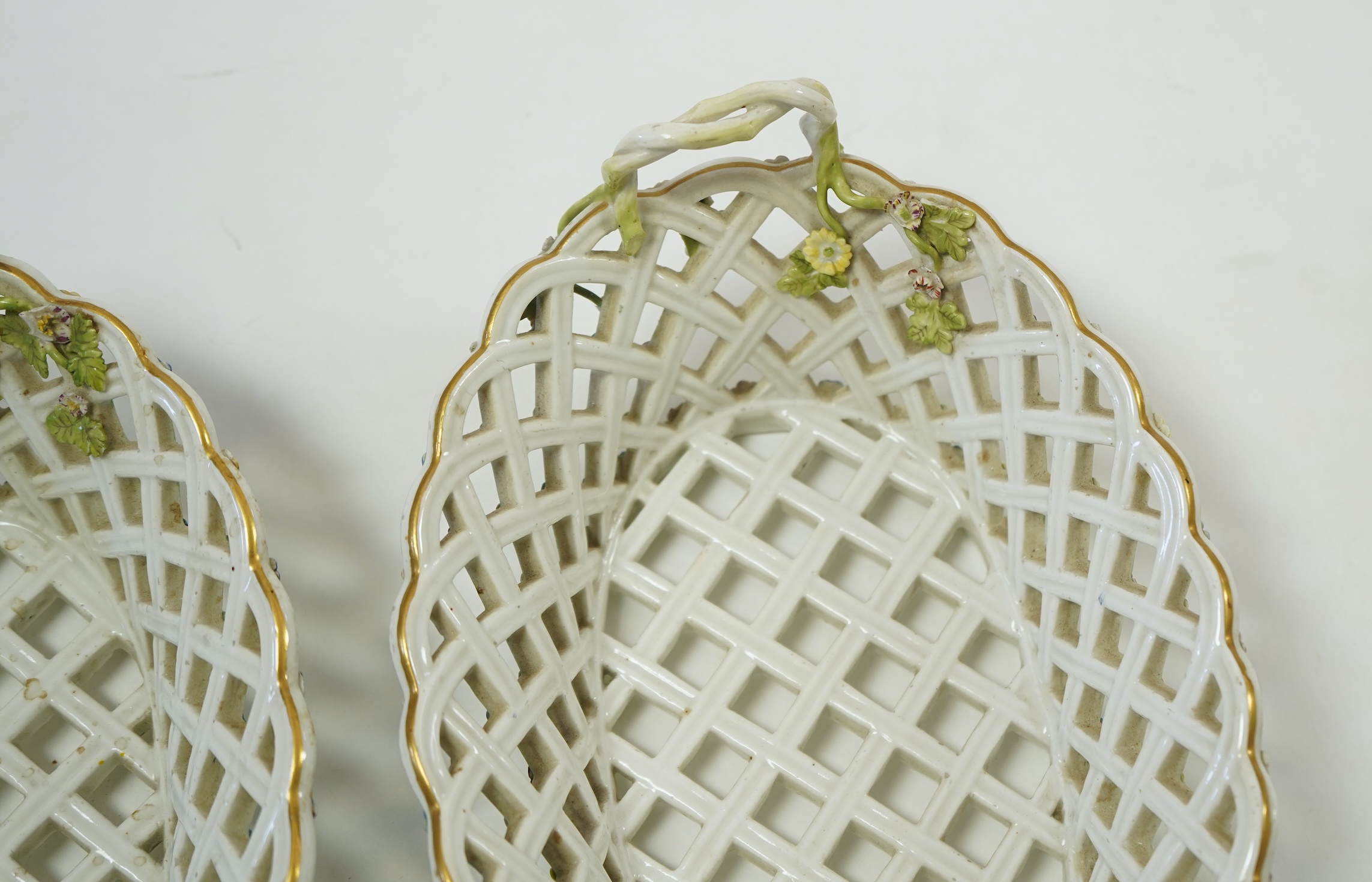A pair of mid 18th century Meissen porcelain reticulated baskets c.1765